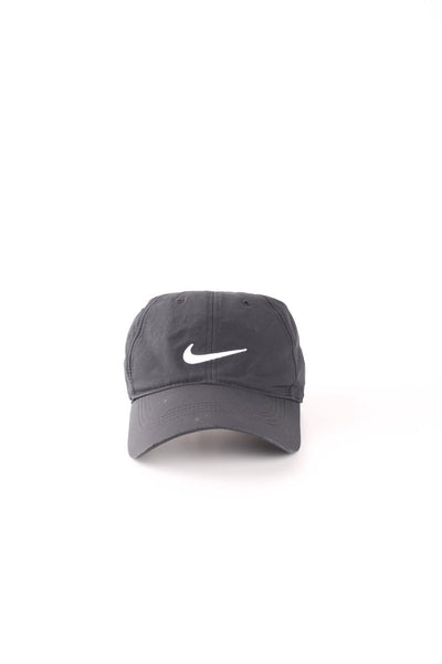 Nike all black lightweight golfing cap with white embroidered 'swoosh' logo on the front