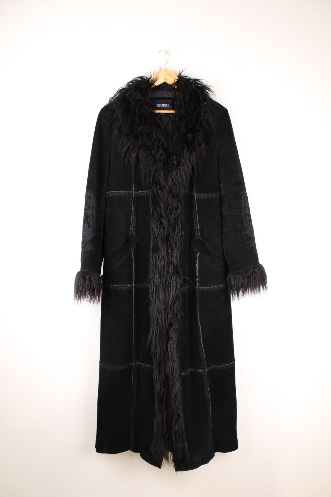 Y2K black suede afghan coat by Bernardo, with faux fur trim, embroidery on the back and sleeves, two side pockets, and hook and eye closure.  