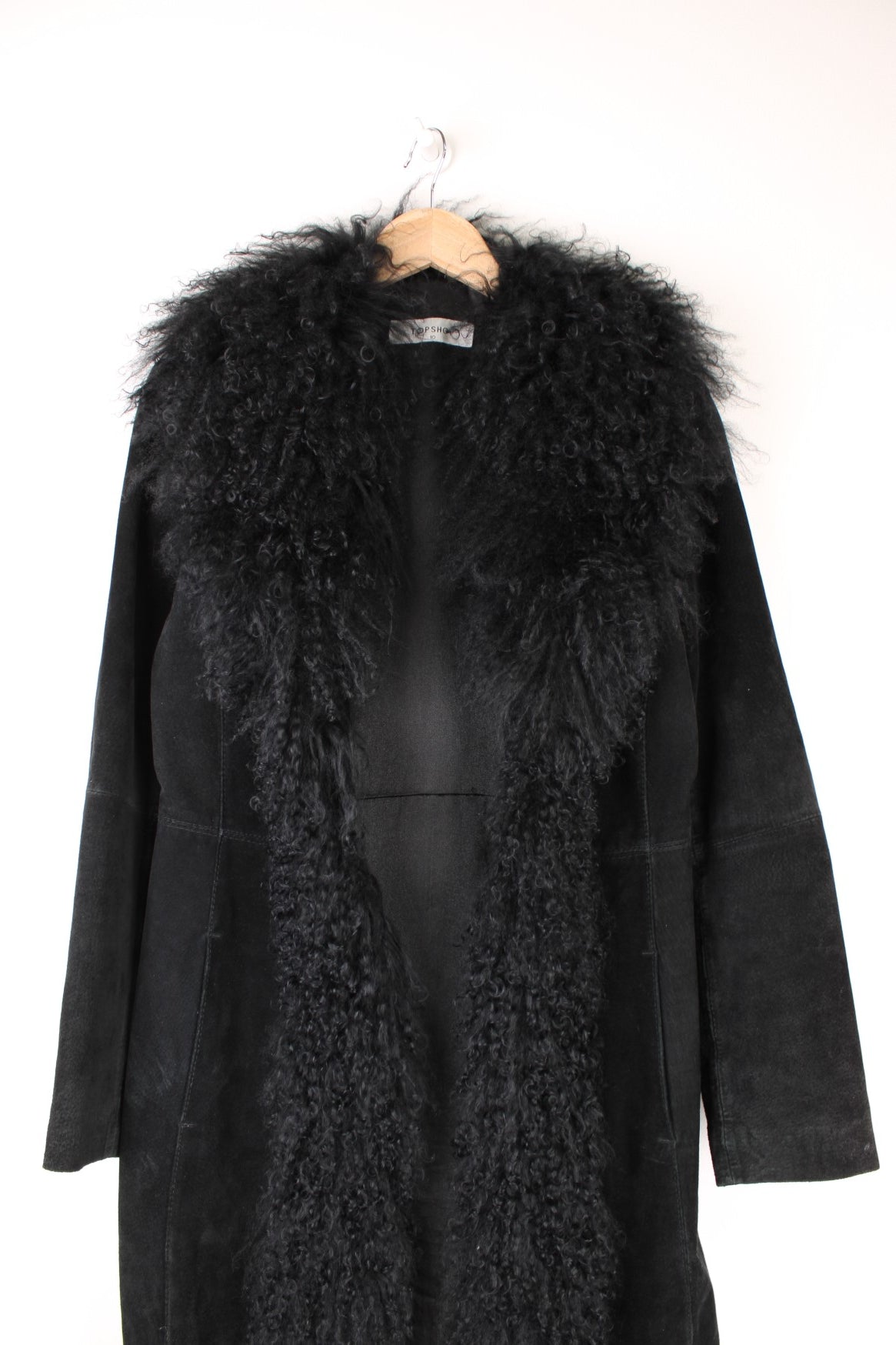 Y2K Topshop afghan coat in black suede with faux fur trim, two side pockets, and hook and eye closure. 