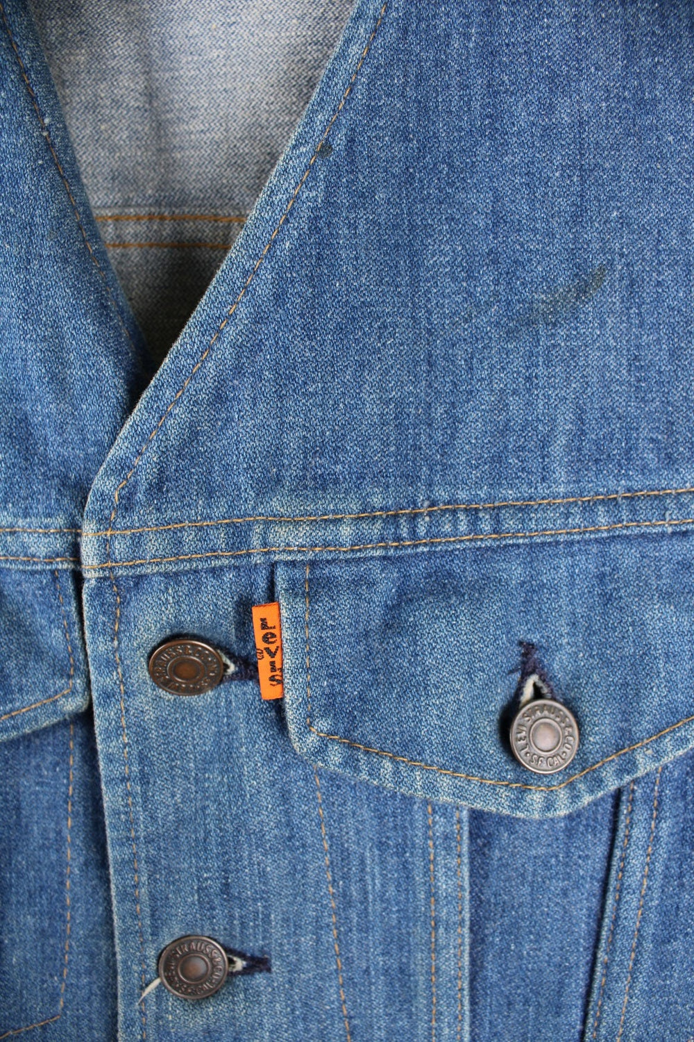 Levi Strauss 1970s Orange Tab waistcoat in a mid blue colourway, The waistcoat has two small breast pockets and it has a slim fitted silhouette. 