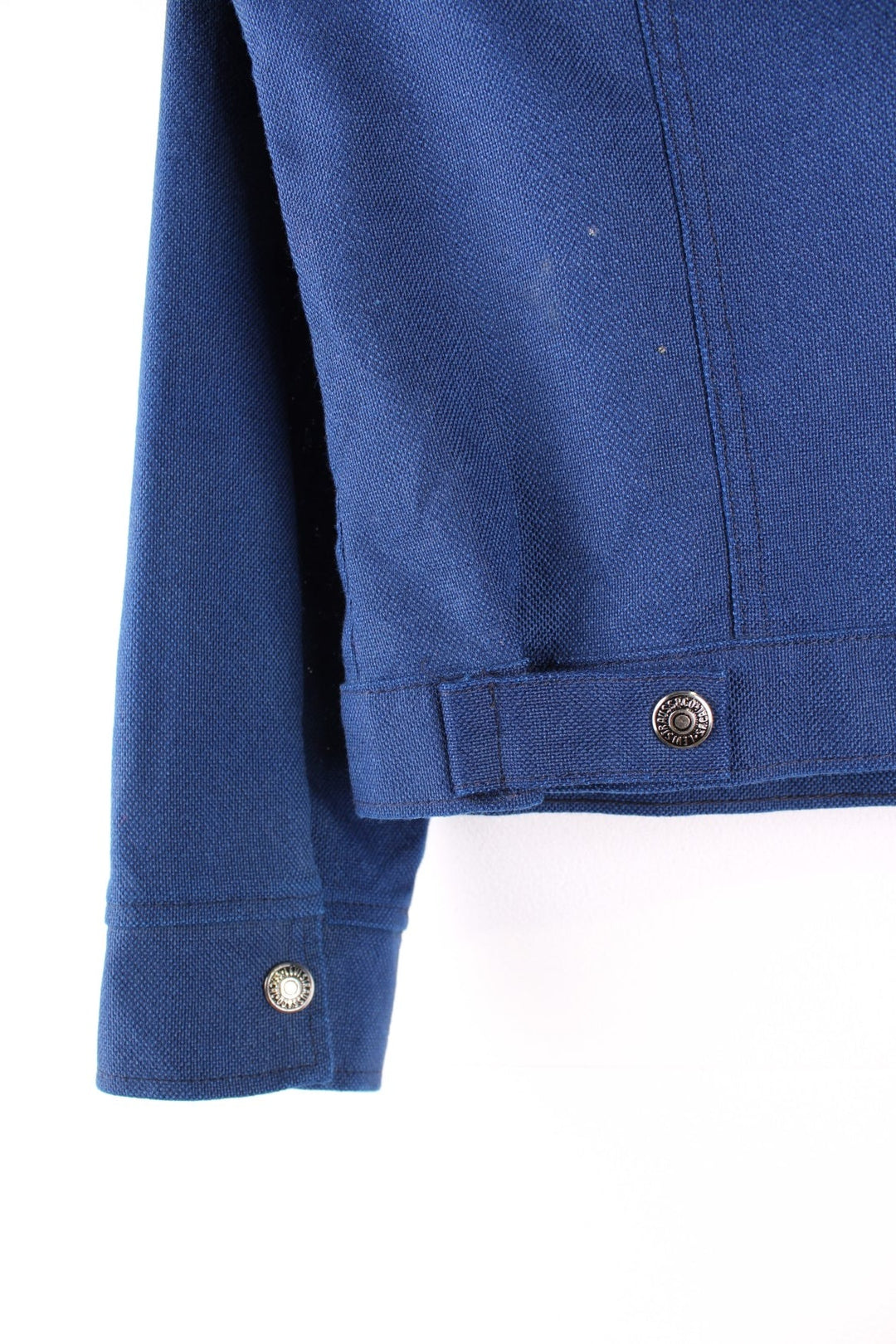 1970s Levi Strauss Trucker/western style jacket in a navy blue colourway. The jacket is one from the Levi's for Gals collection which dates back to 1968. It has two breast pockets, a daggered 1970s style collar and silver buttons. 