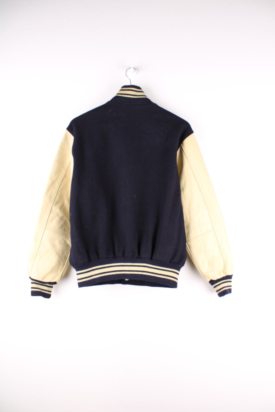 Vintage J Press Varsity Jacket in navy blue with cream sleeves and detail, The jacket has two jetted pockets, a J Press Patch on the front and elasticated cuffs.