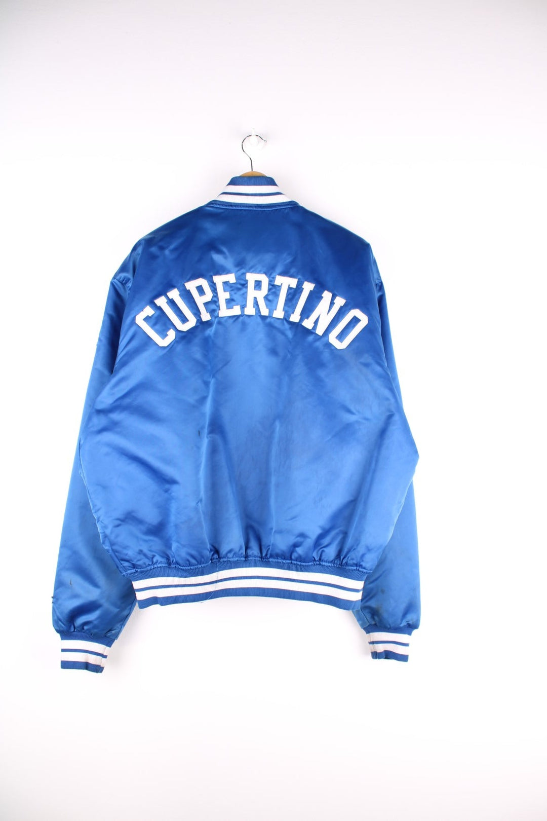 Vintage LA Dodgers baseball jacket in a blue satin colourway. The jacket has the classic elasticated cuffs and collar, press studs to close and was made by Starter, as a part of their Diamond collection and is dated to the 1990S. 