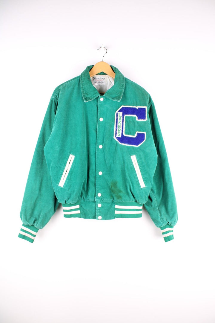 Vintage West Wind / Colchester Laker's corduroy varsity jacket in a green colourway. The jacket has a large Colchester Lakers tufted patch on the front panel, and Colchester is also embroidered on the back. There are jetted pockets, with a contrasting white cord trim and press studs to fasten. Made in the USA. 