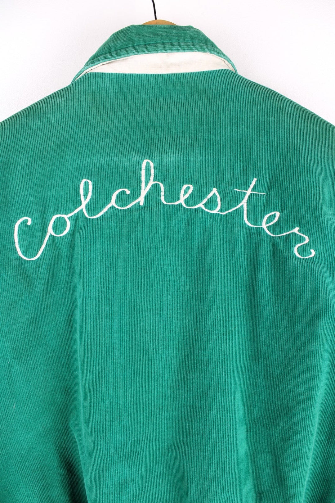 Vintage West Wind / Colchester Laker's corduroy varsity jacket in a green colourway. The jacket has a large Colchester Lakers tufted patch on the front panel, and Colchester is also embroidered on the back. There are jetted pockets, with a contrasting white cord trim and press studs to fasten. Made in the USA. 