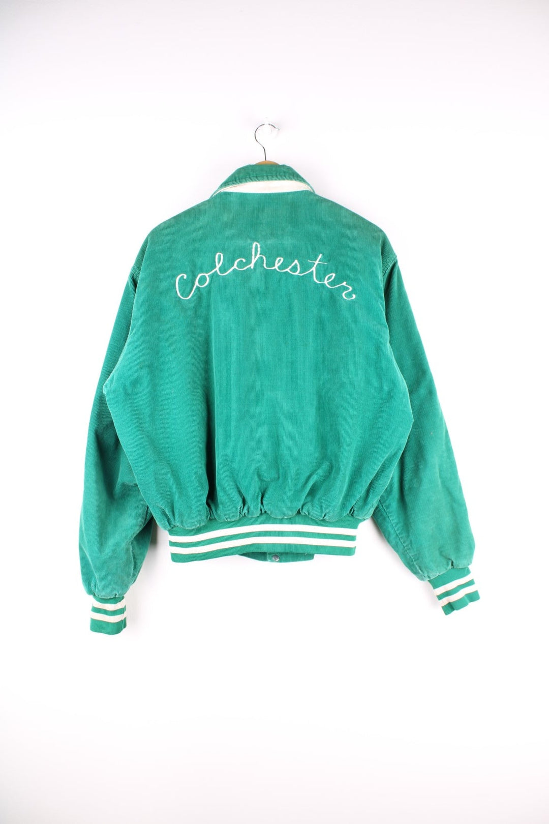 Vintage West Wind / Colchester Laker's corduroy varsity jacket in a green colourway. The jacket has a large Colchester Lakers tufted patch on the front panel, and Colchester is also embroidered on the back. There are jetted pockets, with a contrasting white cord trim and press studs to fasten. Made in the USA. 