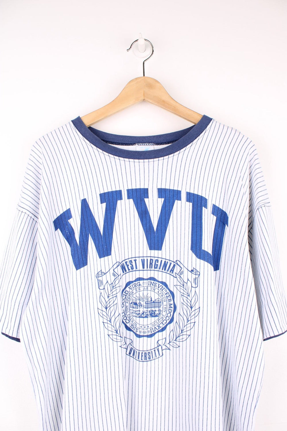 West Virginia University tee in blue and white stripe with crest and initials. 