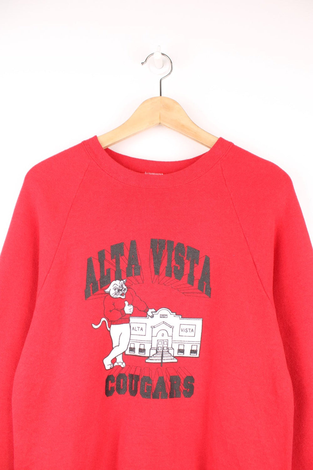 Vintage 'Alta Vista Cougars' graphic sweatshirt in red. 