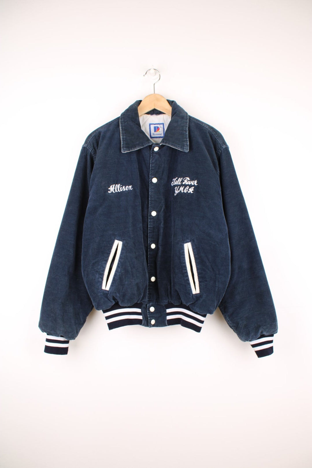 Vintage 90's navy blue corduroy varsity jacket by Rennoc. Features embroidered spell-out motif on the back 'Swim Team' in white, popper buttons fastenings and quilted lining