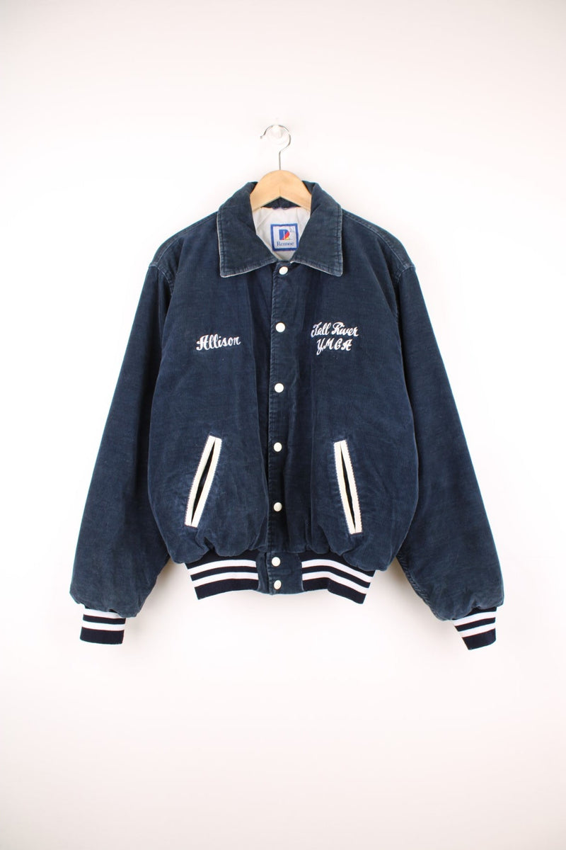 Vintage 90's navy blue corduroy varsity jacket by Rennoc. Features embroidered spell-out motif on the back 'Swim Team' in white, popper buttons fastenings and quilted lining