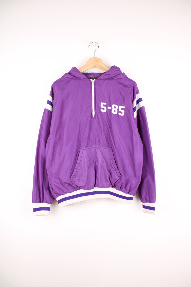 Vintage 1985 Russell Athletic made in the USA, 1/4 zip hooded shell jacket in purple. Features 'Sunset Cross Country' embroidered on the back in white.