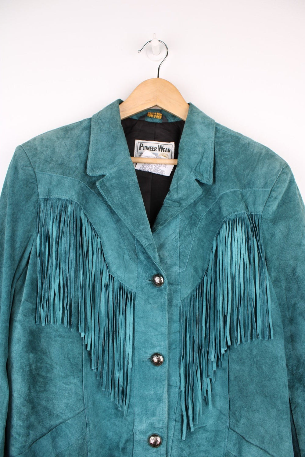 80's Pioneer Wear Western Fringe Jacket in a turquoise blue colourway, button up with a camp collar, has side pockets and tassels all around. 