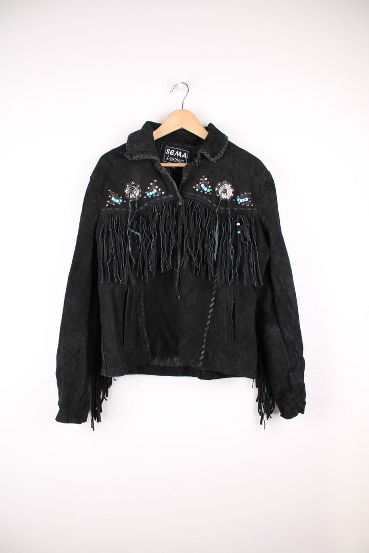 Sema Leathers Western Beaded Fringe Jacket in a black colourway, button up with side pockets, tassels throughout, and has beaded patterns on the front and back. 