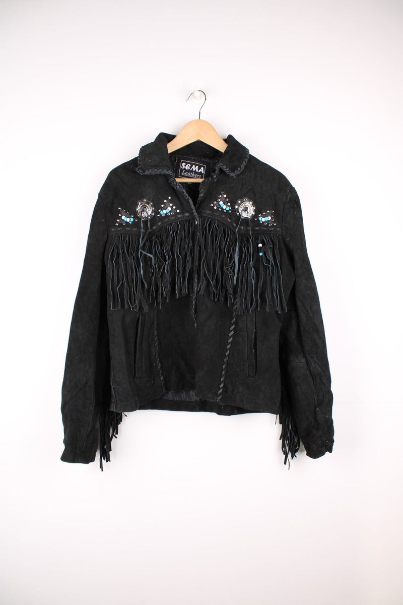 Sema Leathers Western Beaded Fringe Jacket in a black colourway, button up with side pockets, tassels throughout, and has beaded patterns on the front and back. 