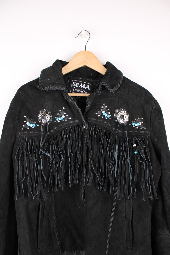 Sema Leathers Western Beaded Fringe Jacket in a black colourway, button up with side pockets, tassels throughout, and has beaded patterns on the front and back. 