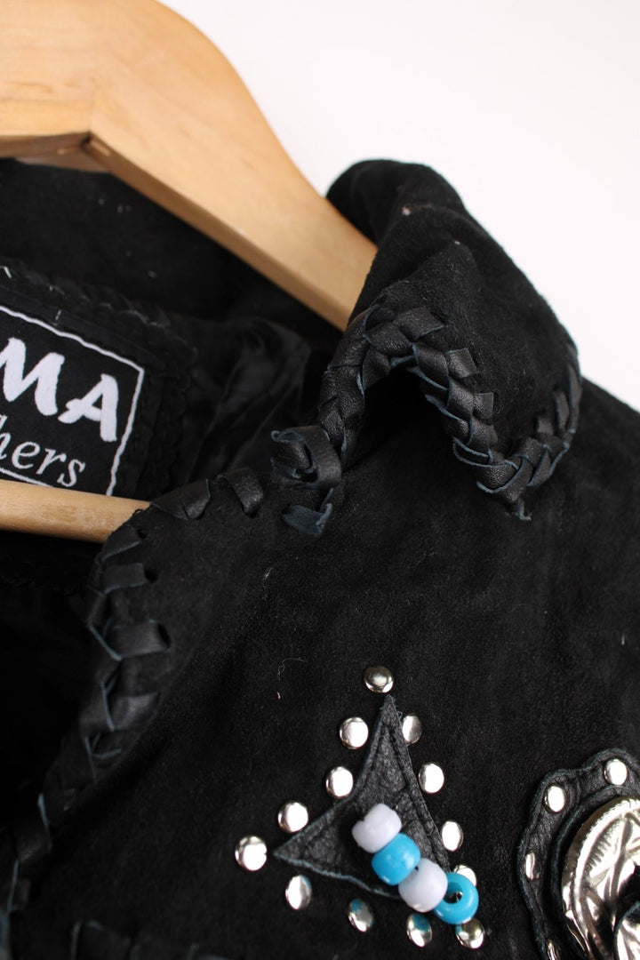 Sema Leathers Western Beaded Fringe Jacket in a black colourway, button up with side pockets, tassels throughout, and has beaded patterns on the front and back. 