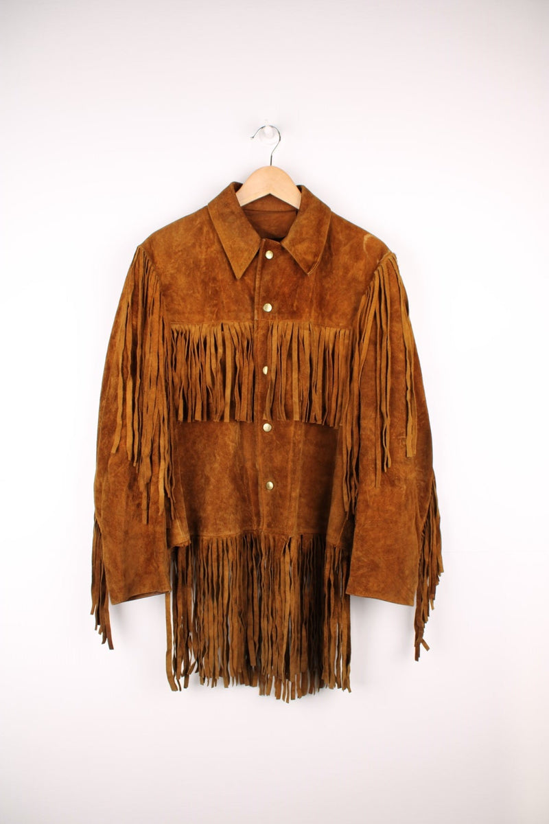 70's Suede Western Fringe Jacket in a brown colourway, button up with double chest pockets, dagger collar, and has tassels all around. 