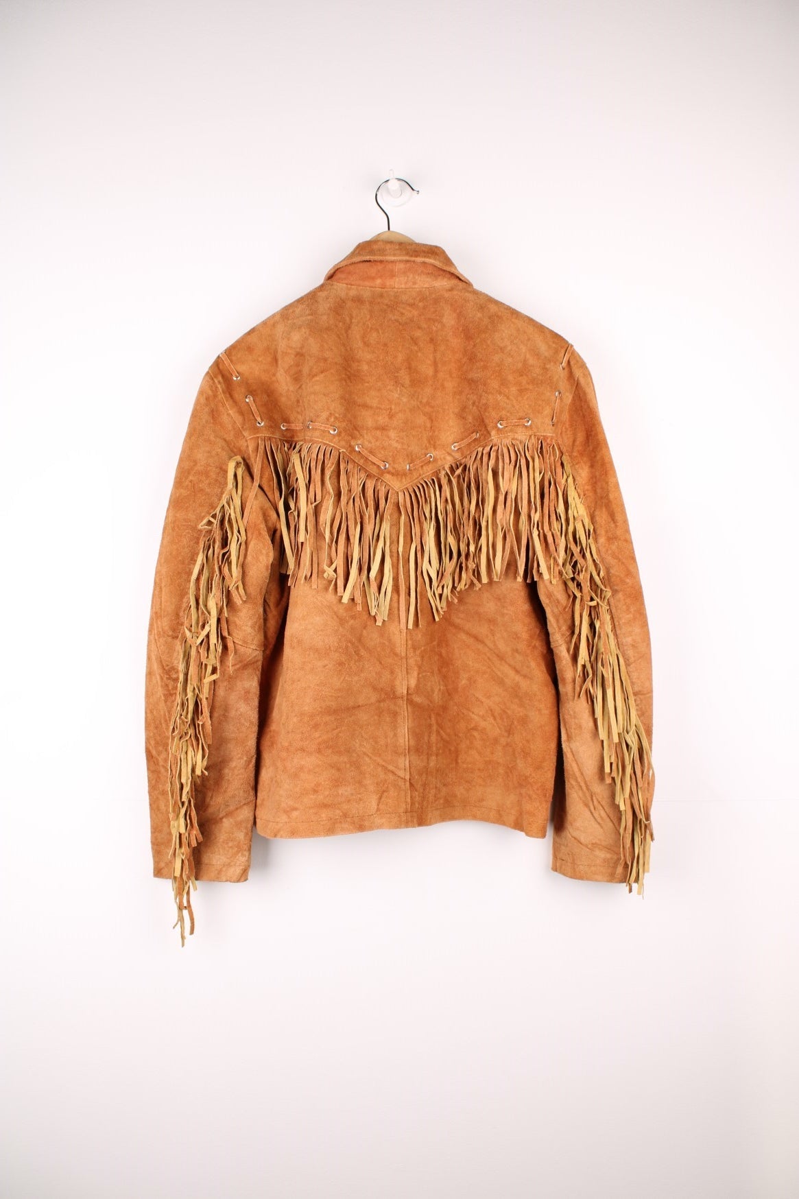 CocobeeUSA Suede Western Fringe Jacket in a brown colourway, zip up with side pockets, and has tassels throughout. 