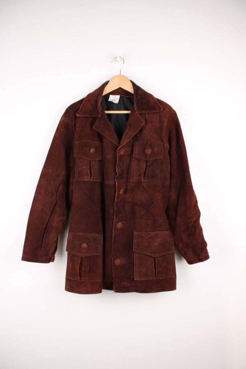 70's Suede Trench Coat in a brown colourway, button up with multiple pockets, camp collar and has a belt. 