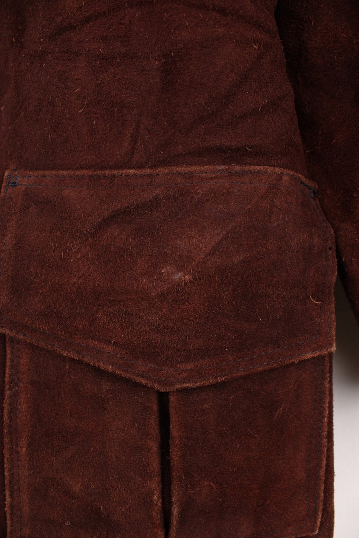 70's Suede Trench Coat in a brown colourway, button up with multiple pockets, camp collar and has a belt. 