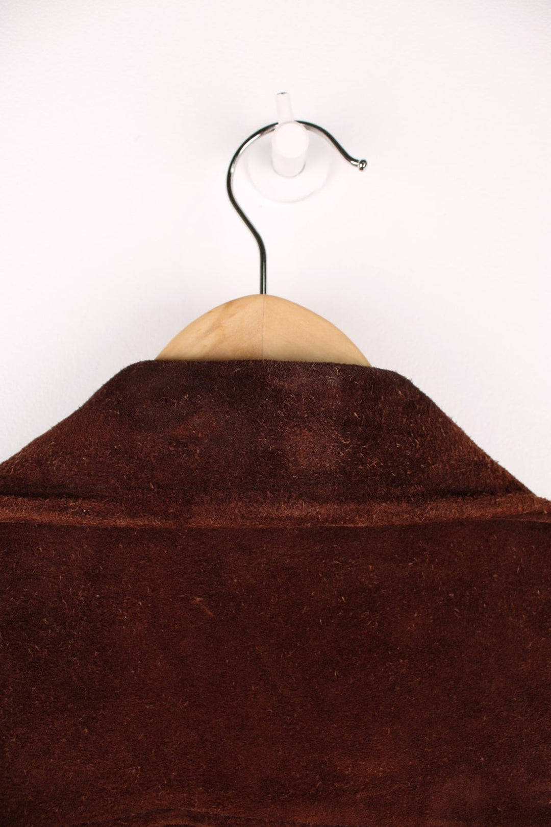 70's Suede Trench Coat in a brown colourway, button up with multiple pockets, camp collar and has a belt. 