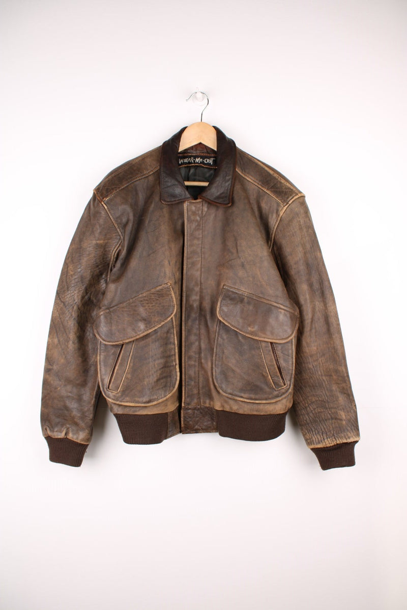 Vintage Wear Me Out Leather Bomber Jacket in a brown colourway, zip up with side pockets, and is insulated with a quilted lining. 