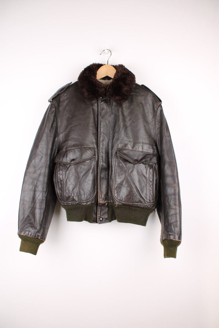 Vintage 60's Schott IS 674 Flight Jacket in a brown colourway with green cuffs, button up with side pockets and has a faux fur collar and lining.