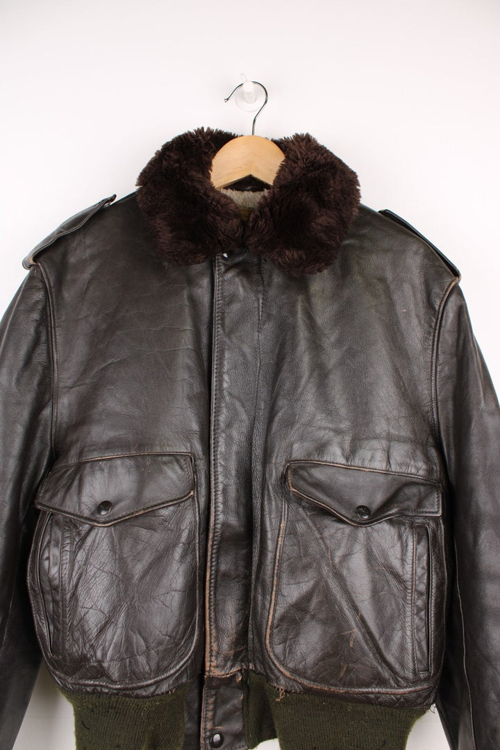 Vintage 60's Schott IS 674 Flight Jacket in a brown colourway with green cuffs, button up with side pockets and has a faux fur collar and lining.