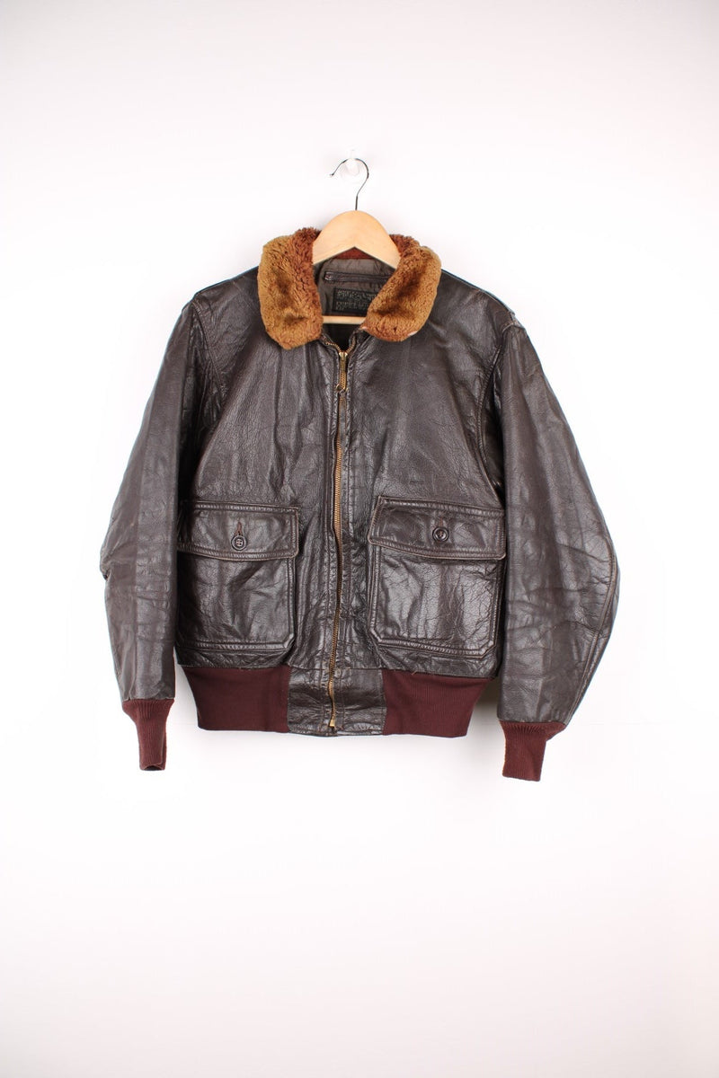 Vintage Leather Flight Aviator Jacket in a brown colourway, zip up with side pockets and has a faux fur collar.