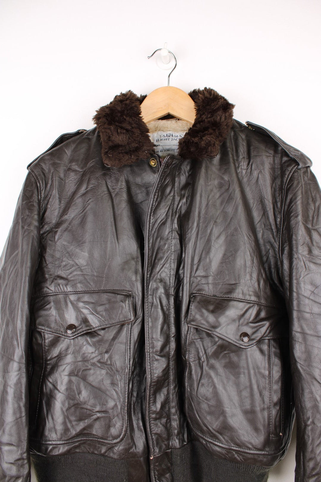 Schott Leather Flight Jacket in a brown colourway with a faux fur collar, zip up with side pockets and has a faux fur lining. 