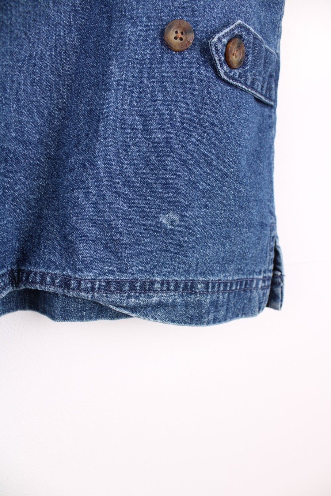 Woolrich Denim Vest in a blue colourway, zips up with a v neck collar and has double pockets on the front. 