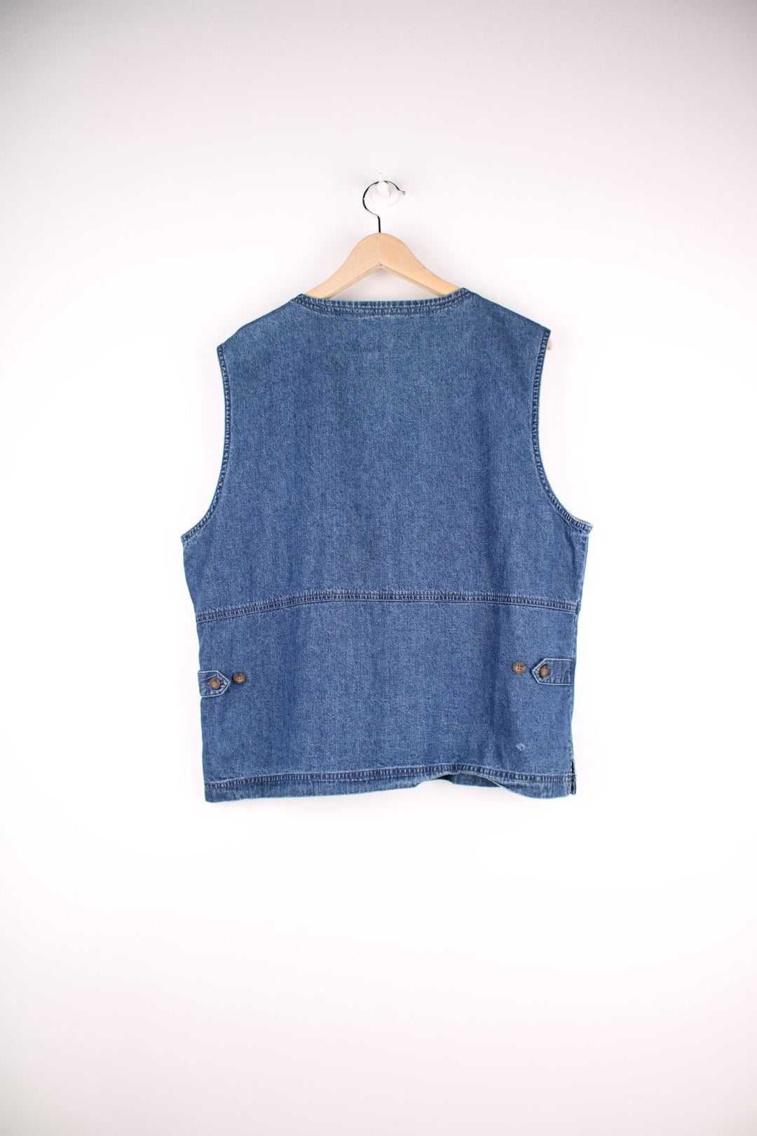 Woolrich Denim Vest in a blue colourway, zips up with a v neck collar and has double pockets on the front. 