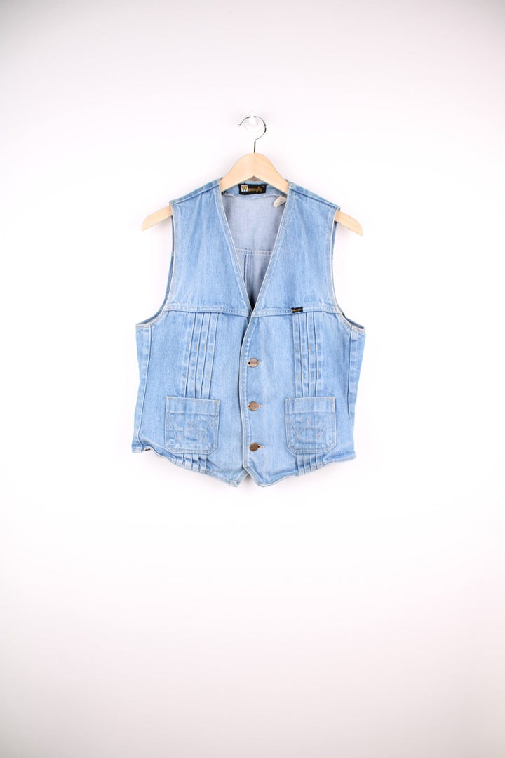 70s Wrangler light wash denim vest with pleats, two pockets, and button closure. 