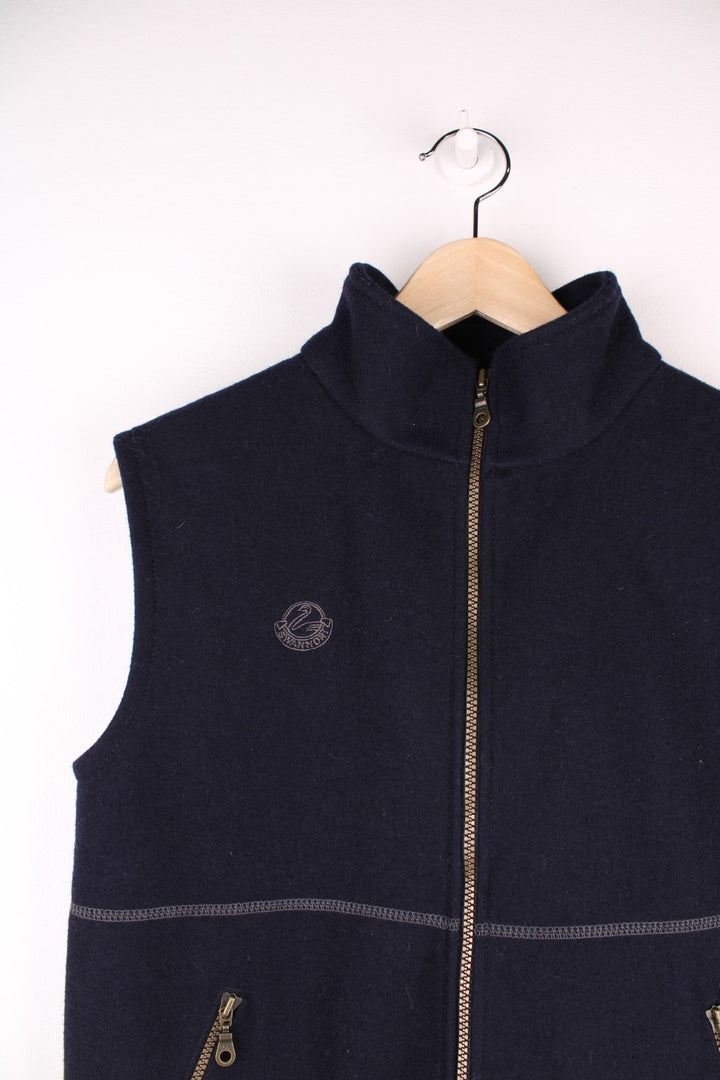 Swanndri Woolen Fleece Gilet in a navy blue colourway, zip up with side pockets, cross stitching going across the front and has the logo embroidered on the front. 