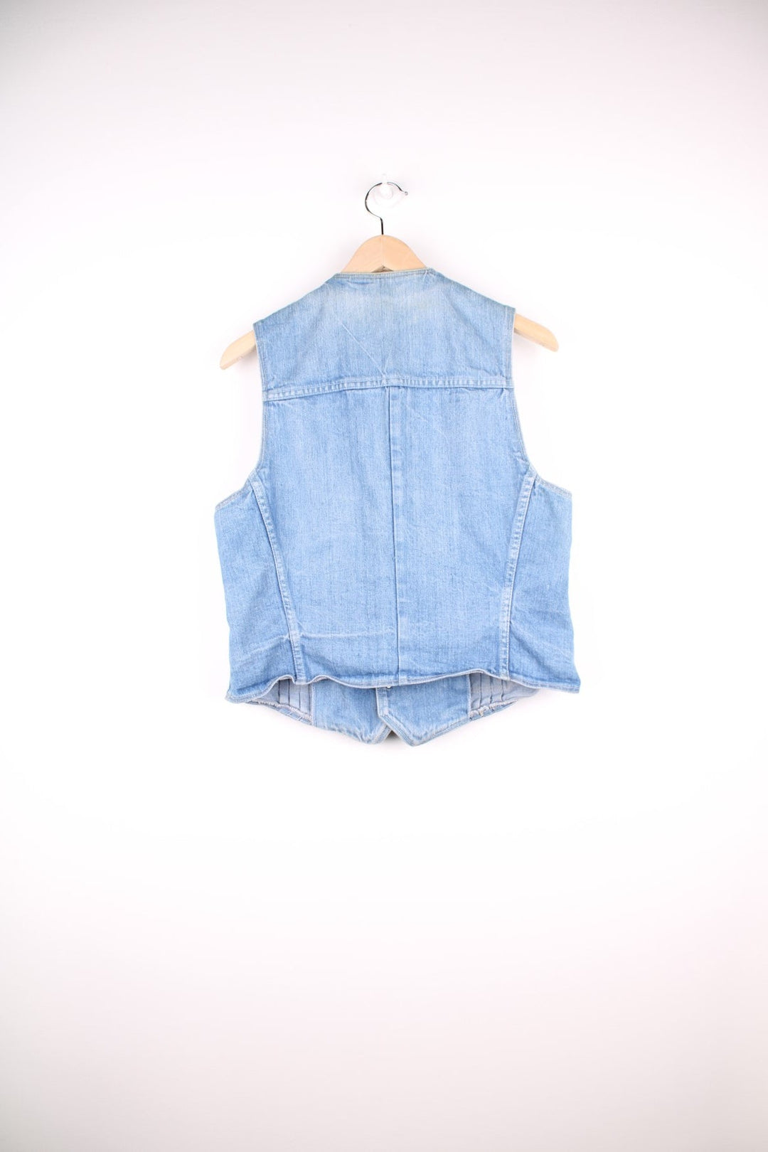 70s Wrangler light wash denim vest with pleats, two pockets, and button closure. 