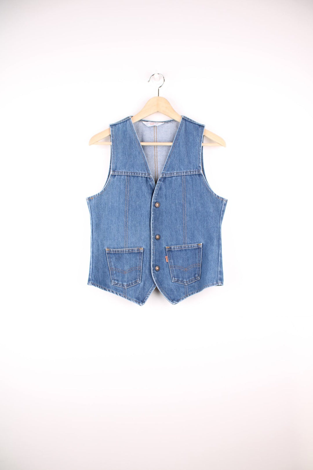 Orange tab Levi's blue denim vest with two patch pockets and button closure.  