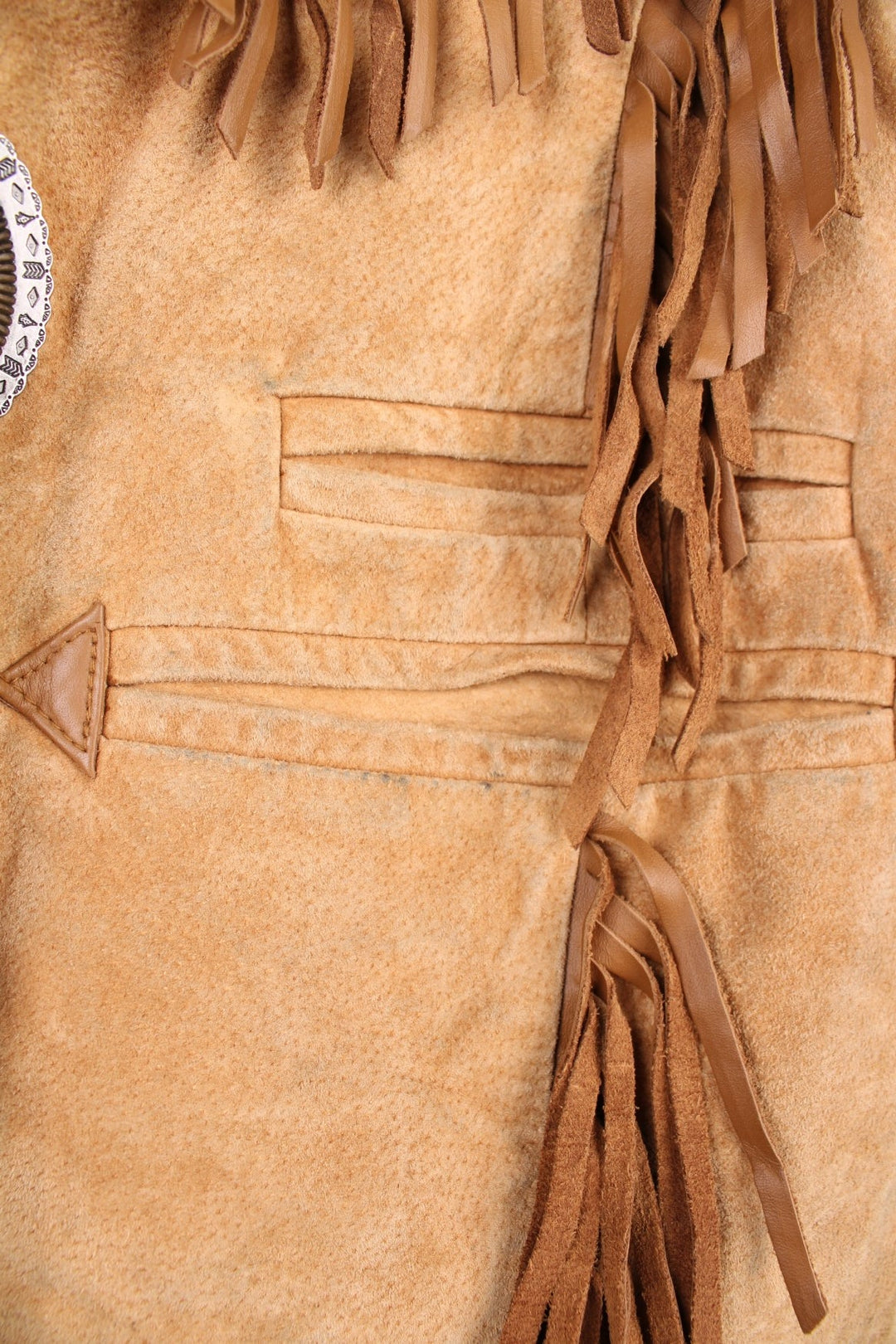 Vintage Scully Western Leather Fringe Waistcoat in a tanned brown colourway, has multiple pockets, embroidered bead native patterns, and has fringe tassels throughout.