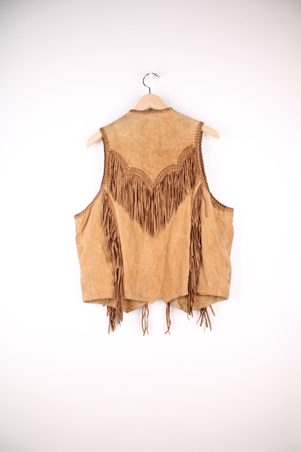 Vintage Scully Western Leather Fringe Waistcoat in a tanned brown colourway, has multiple pockets, embroidered bead native patterns, and has fringe tassels throughout.