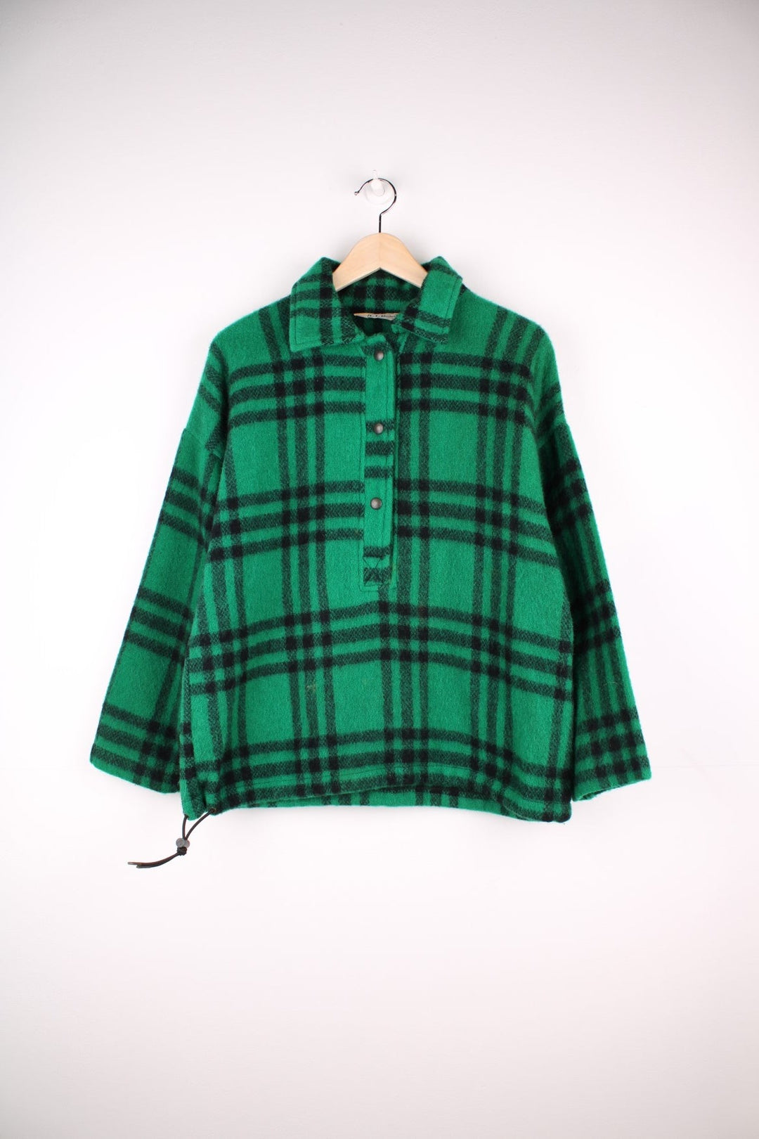 L.L. Bean Plaid Pullover Sweater in a green and black colourway, half button up with a collar, and has a adjustable hem. 