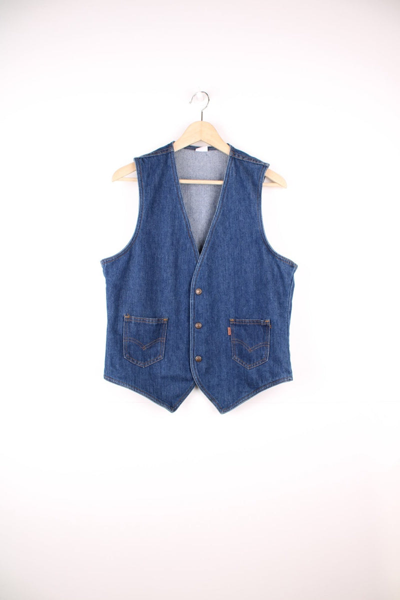 Orange tab Levi's blue denim vest with two patch pockets and button closure.  