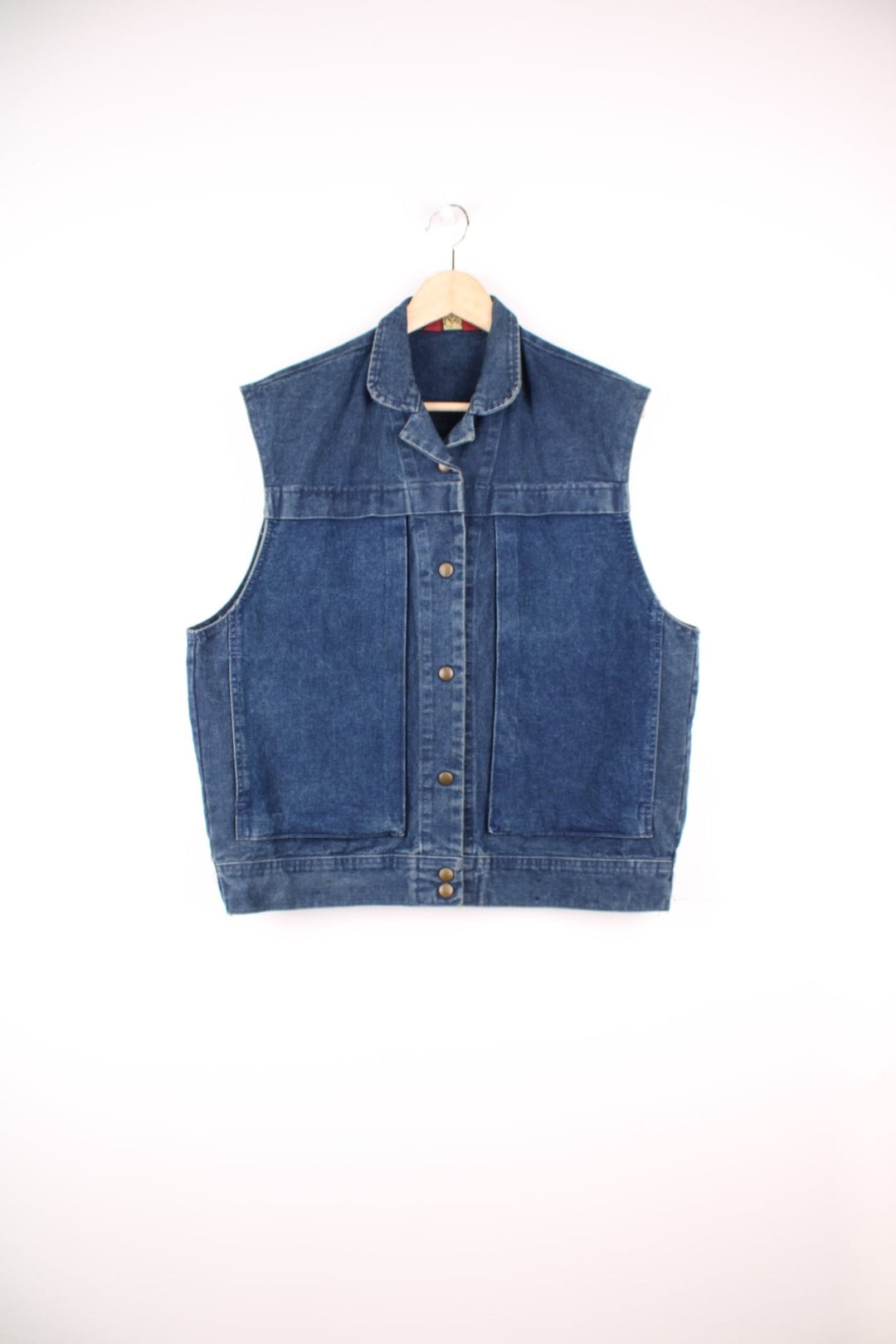 Ms. Lee collared blue denim vest with button closure and double side pockets. 