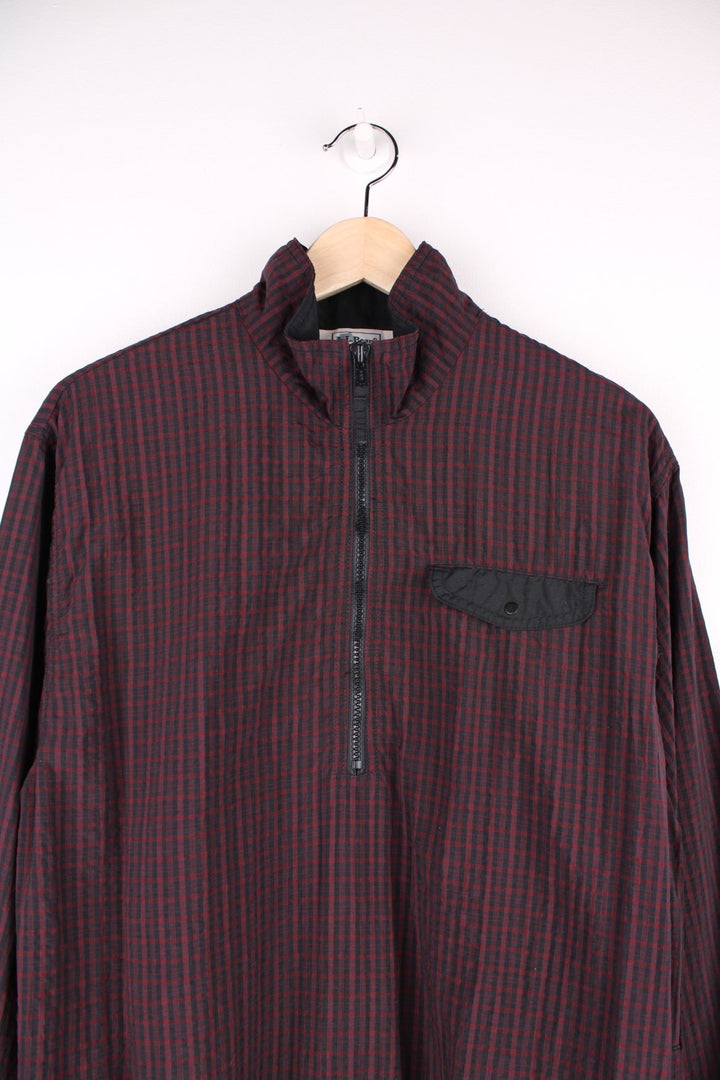 L.L. Bean Pullover Windbreaker in a red and black checkered colourway, half zip up with side pockets, chest pocket, has the logo embroidered by the hem and 3m reflective triangle on the back.