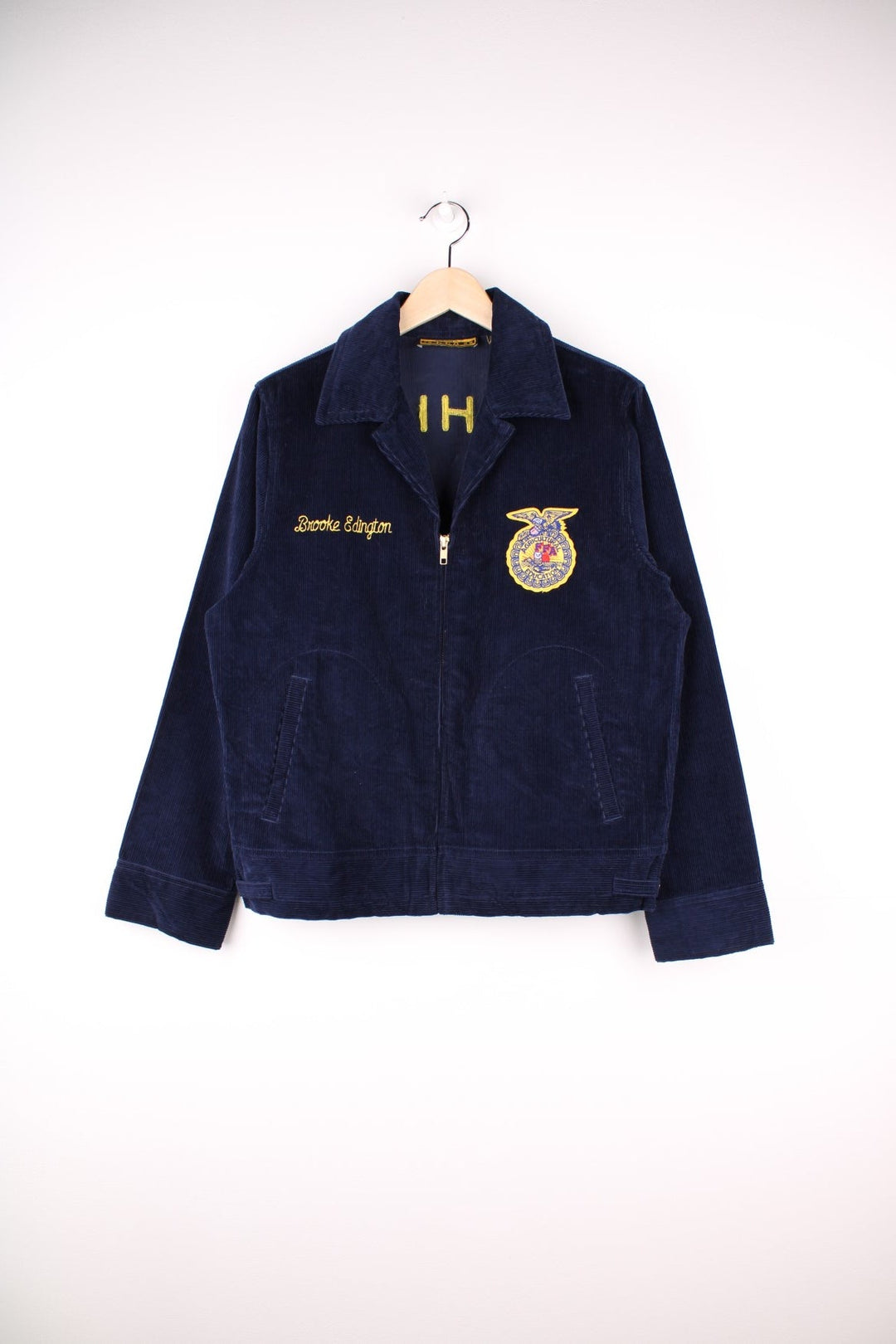 80's FFA Agricultural Education Jacket in blue colourway, zip up with side pockets, v neck dagger collar, and has embroidered logo patches on the front and back. 