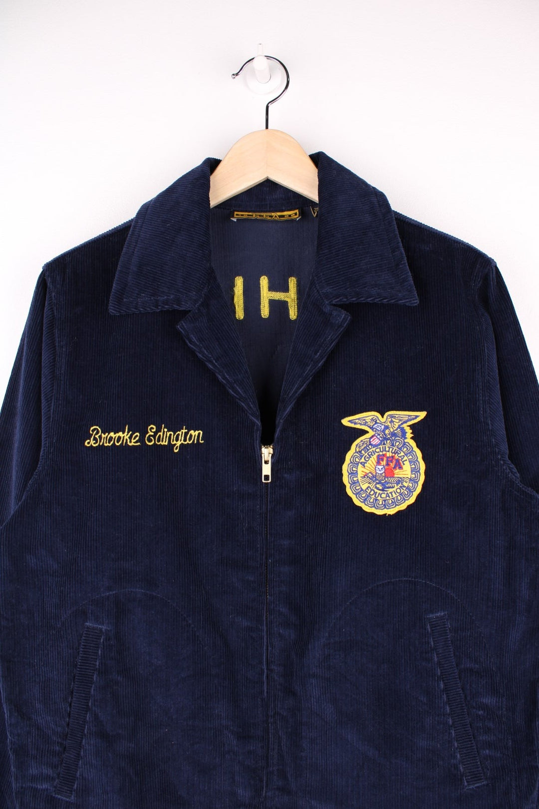 80's FFA Agricultural Education Jacket in blue colourway, zip up with side pockets, v neck dagger collar, and has embroidered logo patches on the front and back. 