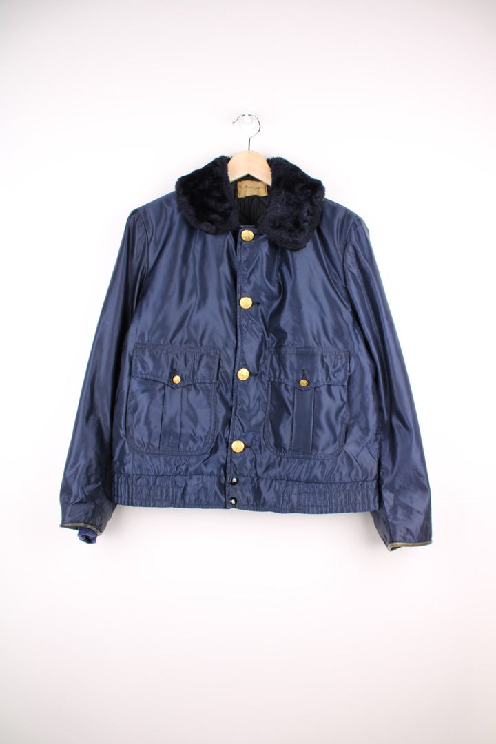 70s Gerber 'Car-Duty' bomber jacket in navy blue - quilt-lined, with a faux fur collar, gold buttons, and four pockets. 