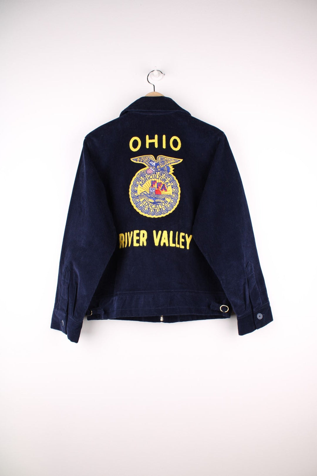 80's FFA Agricultural Education Jacket in blue colourway, zip up with side pockets, v neck dagger collar, and has embroidered logo patches on the front and back. 