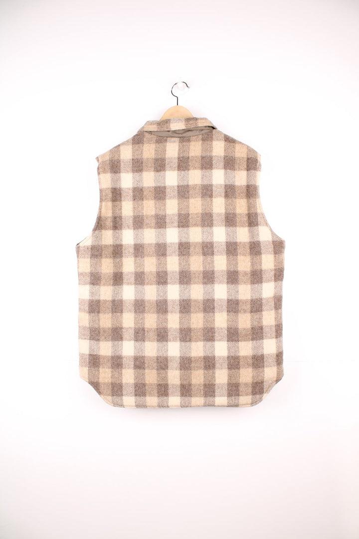 Woolrich tan and cream collared check gilet with a breast pocket and snap closure. 