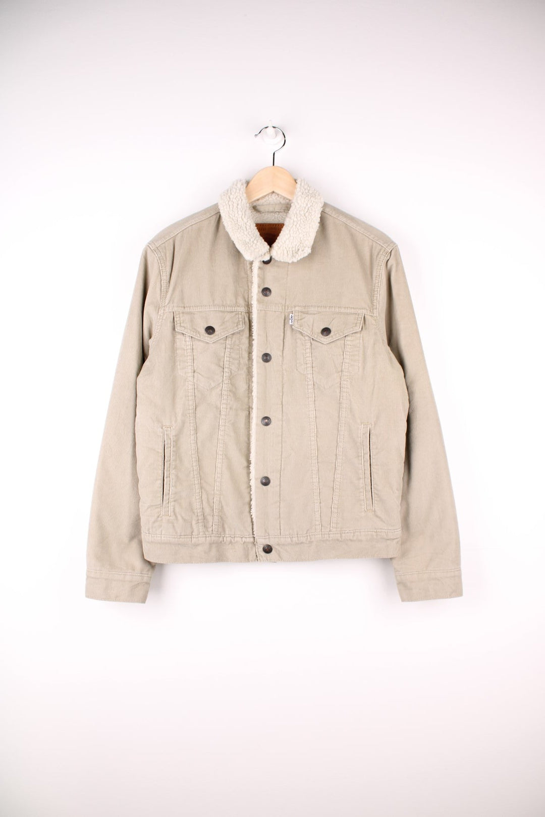 Levi's Corduroy Sherpa Jacket in a tanned colourway with a white sherpa lining, button up with multiple pockets, and has the logo embroidered on the front.