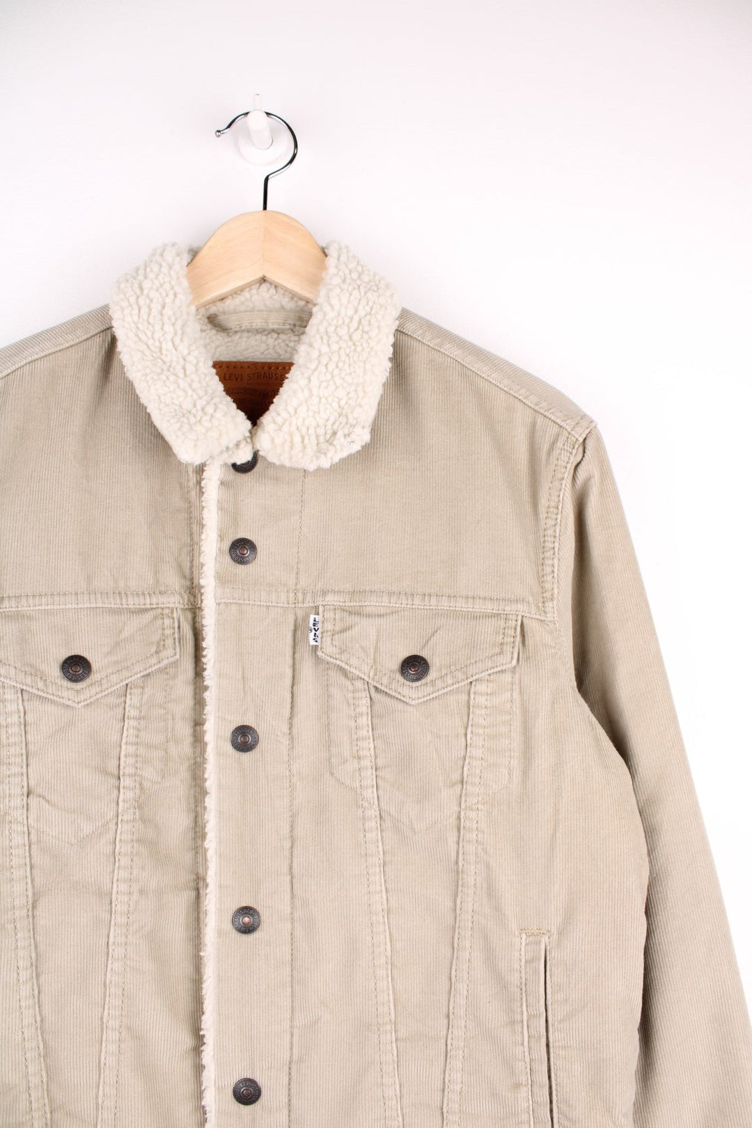 Levi's Corduroy Sherpa Jacket in a tanned colourway with a white sherpa lining, button up with multiple pockets, and has the logo embroidered on the front.