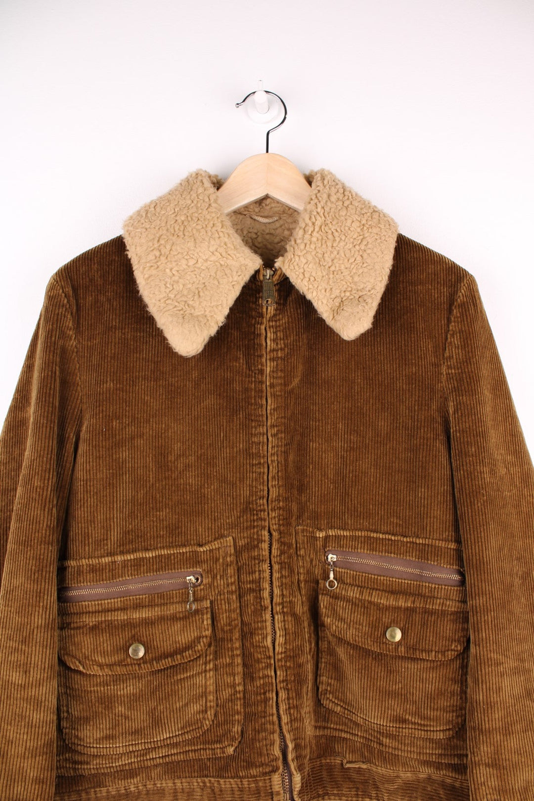 Vintage 80's Corduroy Sherpa Jacket in a brown colourway, zip up with multiple pockets, dagger collar, and has a sherpa lining.